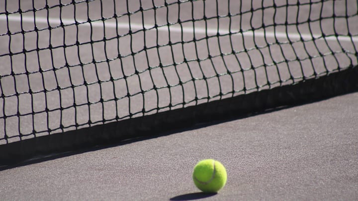 STOCK | A tennis ball rests next to a net during a high school girls tennis match between Bolles and Episcopal in Jacksonville, Florida, on March 21, 2025. [Clayton Freeman/Florida Times-Union]