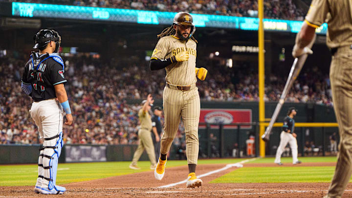 Jun 14, 2025; Phoenix, Arizona, USA; San Diego Padres outfielder Fernando Tatis Jr. (23) comes in to score in the seventh inning against the Arizona Diamondbacks at Chase Field. Mandatory Credit: Allan Henry-Imagn Images