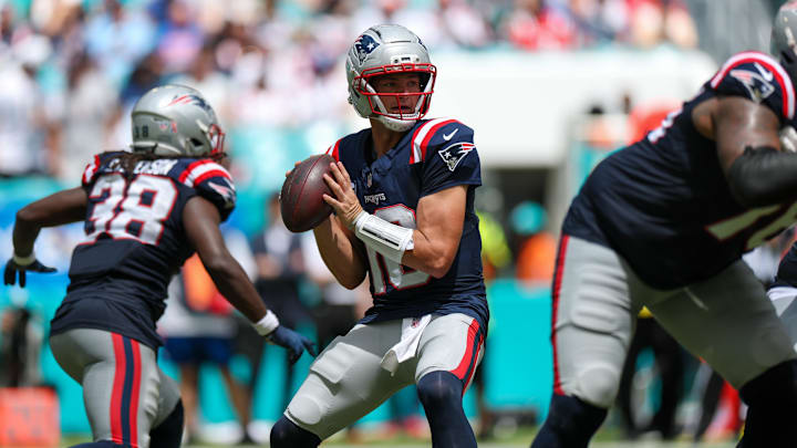 Sep 14, 2025; Miami Gardens, Florida, USA; New England Patriots quarterback Drake Maye (10) looks to pass against the Miami Dolphins in the second quarter at Hard Rock Stadium. Mandatory Credit: Nathan Ray Seebeck-Imagn Images