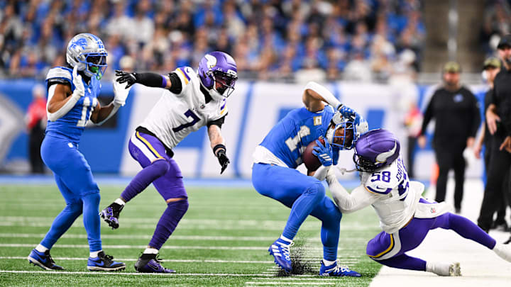 Nov 2, 2025; Detroit, Michigan, USA; Detroit Lions wide receiver Amon-Ra St. Brown (14) is pulled out of bounds by Minnesota Vikings outside linebacker Jonathan Greenard (58) in the fourth quarter at Ford Field. Mandatory Credit: Lon Horwedel-Imagn Images