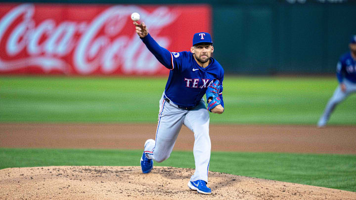 Oakland, California, USA; Texas Rangers starting pitcher Nathan Eovaldi (17) delivers a pitch against the Oakland Athletics during the first inning at Oakland-Alameda County Coliseum.
