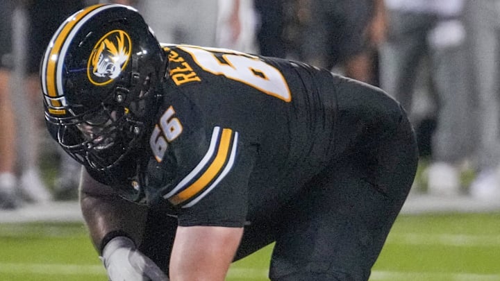 Aug 29, 2024; Columbia, Missouri, USA; Missouri Tigers offensive lineman Logan Reichert (66) on the line of scrimmage against the Murray State Racers during the game at Faurot Field at Memorial Stadium. Mandatory Credit: Denny Medley-Imagn Images Aug 29, 2024; Columbia, Missouri, USA; Missouri Tigers offensive lineman Logan Reichert (66) on the line of scrimmage against the Murray State Racers during the game at Faurot Field at Memorial Stadium. Mandatory Credit: Denny Medley-Imagn Images