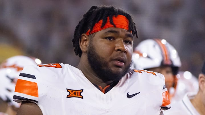 Sep 9, 2023; Tempe, Arizona, USA; Oklahoma State Cowboys offensive lineman Noah McKinney (77) against the Arizona State Sun Devils at Mountain America Stadium. Mandatory Credit: Mark J. Rebilas-Imagn Images