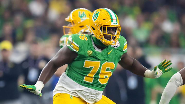 Jan 1, 2024; Glendale, AZ, USA; Oregon Ducks offensive lineman Josh Conerly Jr. (76) against the Liberty Flames during the 2024 Fiesta Bowl at State Farm Stadium. Mandatory Credit: Mark J. Rebilas-Imagn Images