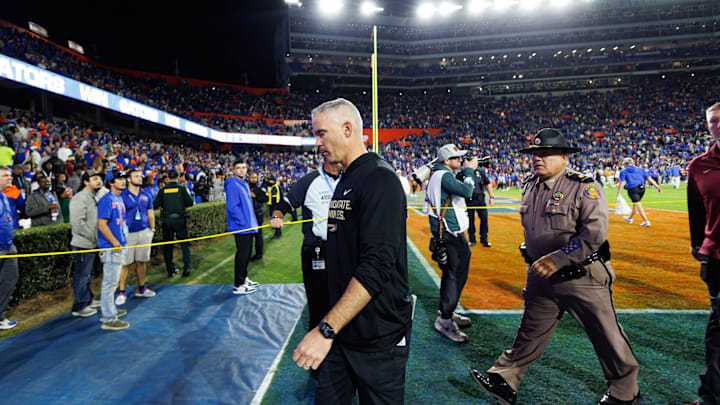 Nov 29, 2025; Gainesville, Florida, USA; Florida State Seminoles head coach Mike Norvell walks off the field after a game against the Florida Gators at Ben Hill Griffin Stadium. Mandatory Credit: Matt Pendleton-Imagn Images