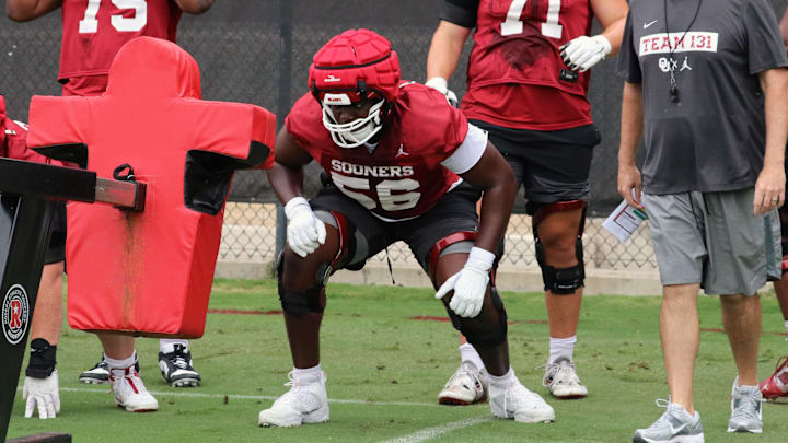 Oklahoma offensive lineman Michael Fasusi before a drill at fall camp.