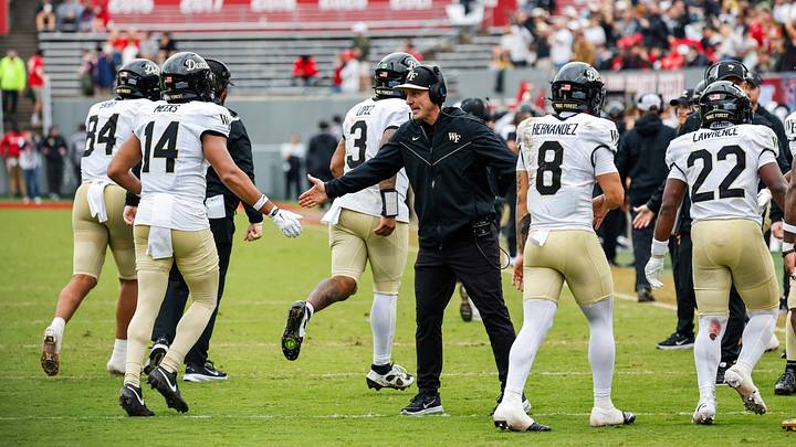 Oct 10, 2026; Raleigh, North Carolina, USA; Wake Forest Demon Deacons head coach Jake Dickert celebrates a touchdown with players during the second half of the game against NC State Wolfpack at Carter-Finley Stadium. Mandatory Credit: Jaylynn Nash-Imagn Images Oct 10, 2026; Raleigh, North Carolina, USA; Wake Forest Demon Deacons head coach Jake Dickert celebrates a touchdown with players during the second half of the game against NC State Wolfpack at Carter-Finley Stadium. Mandatory Credit: Jaylynn Nash-Imagn Images