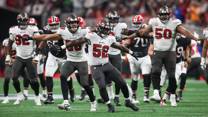 Oct 3, 2024; Atlanta, Georgia, USA; Tampa Bay Buccaneers linebacker K.J. Britt (52) and linebacker Anthony Nelson (98) and defensive tackle Vita Vea (50) react after a blocked field goal against the Atlanta Falcons in the fourth quarter at Mercedes-Benz Stadium. Mandatory Credit: Brett Davis-Imagn Images