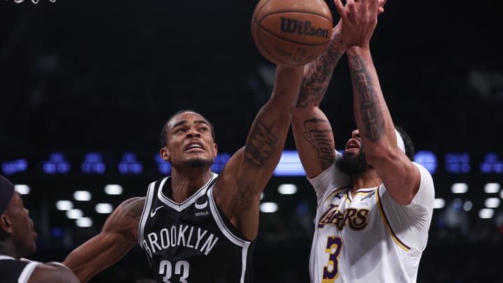Mar 31, 2024; Brooklyn, New York, USA; Brooklyn Nets center Nic Claxton (33) battles Los Angeles Lakers forward Anthony Davis (3) for the ball during the second half at Barclays Center. Mandatory Credit: Vincent Carchietta-USA TODAY Sports Mar 31, 2024; Brooklyn, New York, USA; Brooklyn Nets center Nic Claxton (33) battles Los Angeles Lakers forward Anthony Davis (3) for the ball during the second half at Barclays Center. Mandatory Credit: Vincent Carchietta-USA TODAY Sports