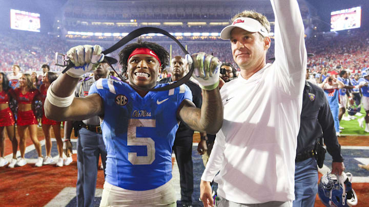 Nov 15, 2025; Oxford, Mississippi, USA; Mississippi Rebels running back Kewan Lacy (5) and head coach Lane Kiffin react after defeating the Florida Gators at Vaught-Hemingway Stadium. Mandatory Credit: Petre Thomas-Imagn Images