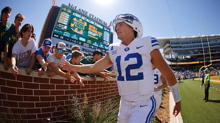 Jake Retzlaff high fives fans at McLane Stadium after posting a win over Baylor.