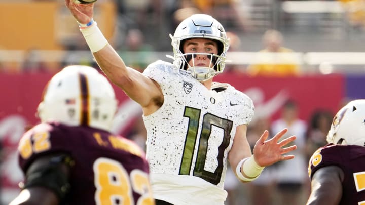 Oregon Ducks quarterback Bo Nix (10) throws a touchdown pass against the Arizona State Sun Devils in the first half at Mountain America Stadium in Tempe on Nov. 18, 2023. Oregon Ducks quarterback Bo Nix (10) throws a touchdown pass against the Arizona State Sun Devils in the first half at Mountain America Stadium in Tempe on Nov. 18, 2023.