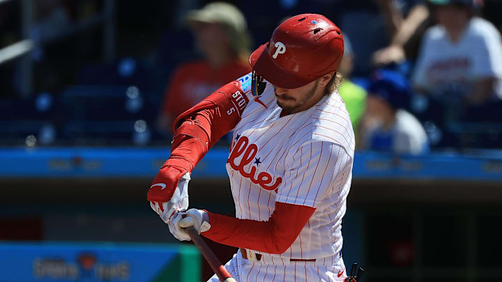 Mar 4, 2026; Clearwater, FL, USA; Philadelphia Phillies second baseman Bryson Stott (5) singles during the second inning against Team Canada at BayCare Ballpark. Mandatory Credit: Kim Klement Neitzel-Imagn Images