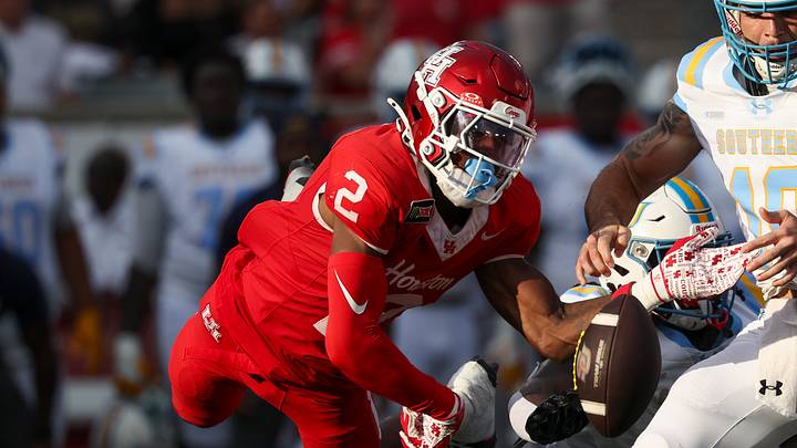 Sep 12, 2026; Houston, Texas, USA; Houston Cougars cornerback Jalen Mayo (2) strips the ball away from Southern University Jaguars quarterback Christian Johnson (10) during the first quarter at TDECU Stadium. Mandatory Credit: Troy Taormina-Imagn Images Sep 12, 2026; Houston, Texas, USA; Houston Cougars cornerback Jalen Mayo (2) strips the ball away from Southern University Jaguars quarterback Christian Johnson (10) during the first quarter at TDECU Stadium. Mandatory Credit: Troy Taormina-Imagn Images