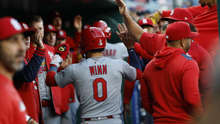May 9, 2025; Washington, District of Columbia, USA; St. Louis Cardinals shortstop Masyn Winn (0) and Cardinals outfielder Lars Nootbaar (21) celebrate with teammates in the dugout after both score runs on a double by St. Louis Cardinals first base Willson Contreras (not pictured) against the Washington Nationals during the first inning at Nationals Park. Mandatory Credit: Geoff Burke-Imagn Images