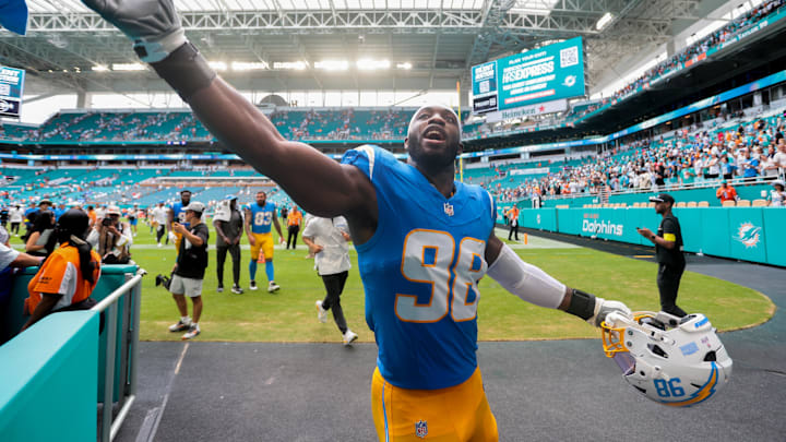 Oct 12, 2025; Miami Gardens, Florida, USA; Los Angeles Chargers linebacker Odafe Oweh (98) celebrates with fans after the game against the Miami Dolphins at Hard Rock Stadium. Mandatory Credit: Sam Navarro-Imagn Images