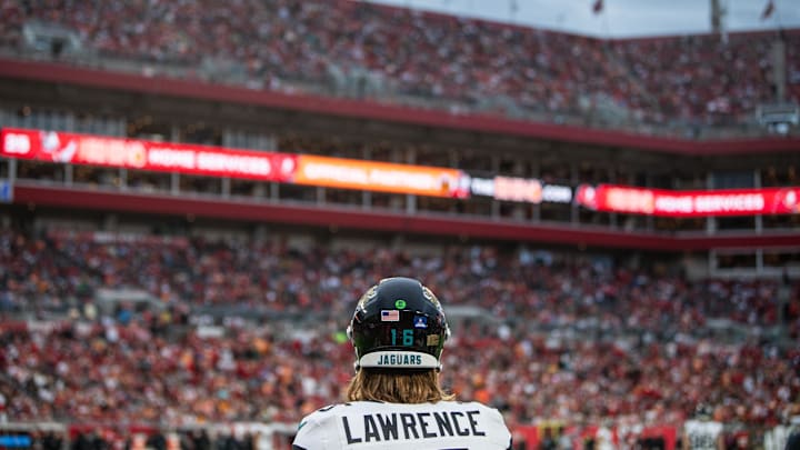 Dec 24, 2023; Tampa, Florida, USA; Jacksonville Jaguars quarterback Trevor Lawrence (16) on the sideline against the Tampa Bay Buccaneers in the third quarter at Raymond James Stadium. Mandatory Credit: Jeremy Reper-USA TODAY Sports Dec 24, 2023; Tampa, Florida, USA; Jacksonville Jaguars quarterback Trevor Lawrence (16) on the sideline against the Tampa Bay Buccaneers in the third quarter at Raymond James Stadium. Mandatory Credit: Jeremy Reper-USA TODAY Sports
