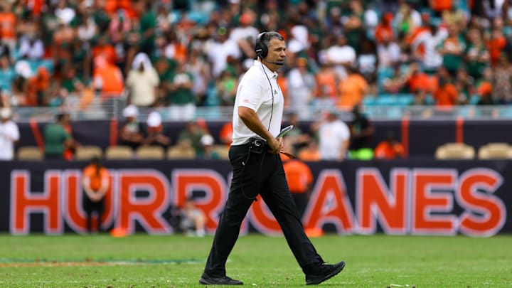Nov 2, 2024; Miami Gardens, Florida, USA; Miami Hurricanes head coach Mario Cristobal looks on from the field against the Duke Blue Devils during the fourth quarter at Hard Rock Stadium. Mandatory Credit: Sam Navarro-Imagn Images