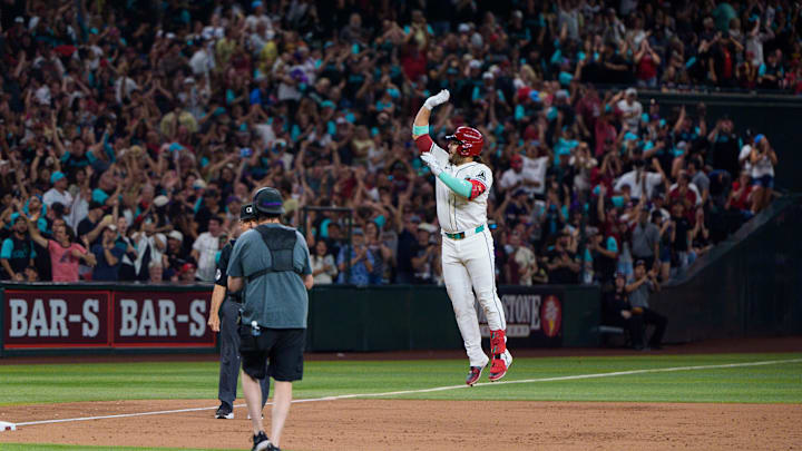 Phoenix, Arizona, USA; Arizona Diamondbacks infielder Eugenio Suarez (28) reacts after hitting his fourth home run of the game against the Atlanta Braves during the ninth inning at Chase Field.