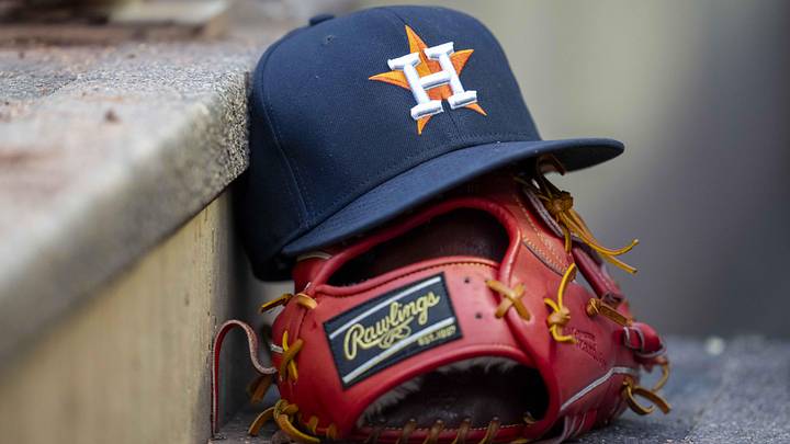 A general view of a Houston Astros hat and glove in the dugout during the fifth inning against the Minnesota Twins at Target Field. A general view of a Houston Astros hat and glove in the dugout during the fifth inning against the Minnesota Twins at Target Field.