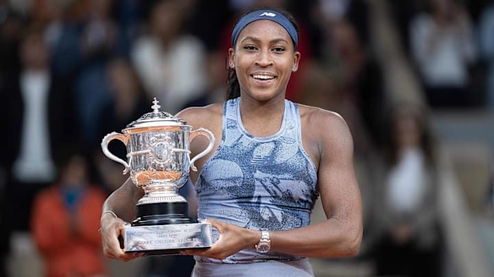 Coco Gauff of the United States poses with the trophy after winning the womenís singles final against Aryna Sabalenka on day 14 at Roland Garros Stadium.
