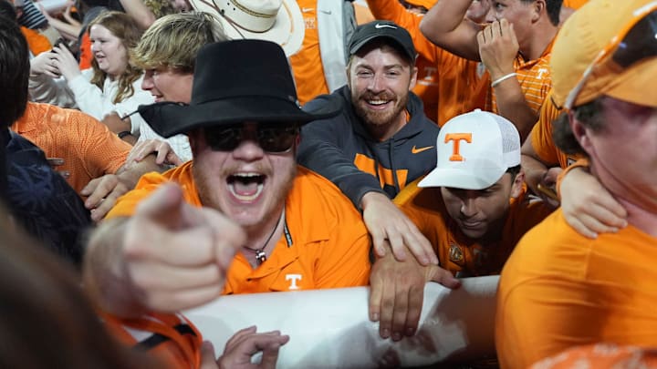 Tennessee fans carry a goalpost across the field after it was taken down after Tennessee's win over Alabama in an NCAA college football game on Saturday, Oct. 19, 2024, in Knoxville. Tenn. (The very Tennessee fans who pushed me out of the way so I wouldn't get hit by a goalpost.)