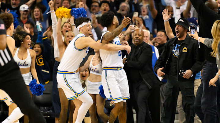 Feb 21, 2026; Los Angeles, California, USA; UCLA guard Donovan Dent (2) celebrates scoring the winning basket in overtime against the Illinois Fighting Illini at Pauley Pavilion presented by Wescom Financial. Mandatory Credit: Robert Hanashiro-Imagn Images