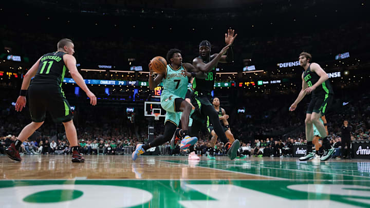 Apr 13, 2025; Boston, Massachusetts, USA; Charlotte Hornets guard Damion Baugh (7) drives to the basket defended by Boston Celtics center Neemias Queta (88) during the second half at TD Garden. Mandatory Credit: Paul Rutherford-Imagn Images Apr 13, 2025; Boston, Massachusetts, USA; Charlotte Hornets guard Damion Baugh (7) drives to the basket defended by Boston Celtics center Neemias Queta (88) during the second half at TD Garden. Mandatory Credit: Paul Rutherford-Imagn Images