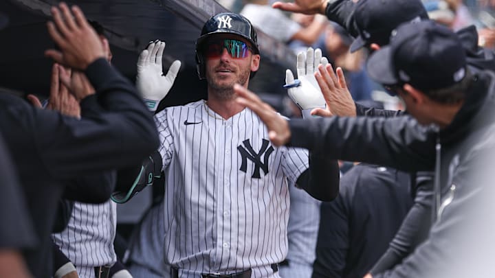 New York Yankees left fielder Cody Bellinger (35) celebrates with teammates after hitting a solo home run against the Baltimore Orioles during the second inning at Yankee Stadium.