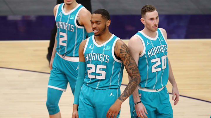 Feb 24, 2021; Phoenix, Arizona, USA; Charlotte Hornets forward P.J. Washington (25) with forward Gordon Hayward (20)