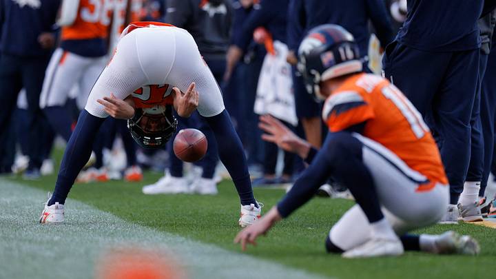 Dec 14, 2025; Denver, Colorado, USA; Denver Broncos long snapper Mitchell Fraboni (48) snaps the ball to punter Jeremy Crawshaw (16) on the sidelines during the second quarter against the Green Bay Packers at Empower Field at Mile High. Mandatory Credit: Isaiah J. Downing-Imagn Images