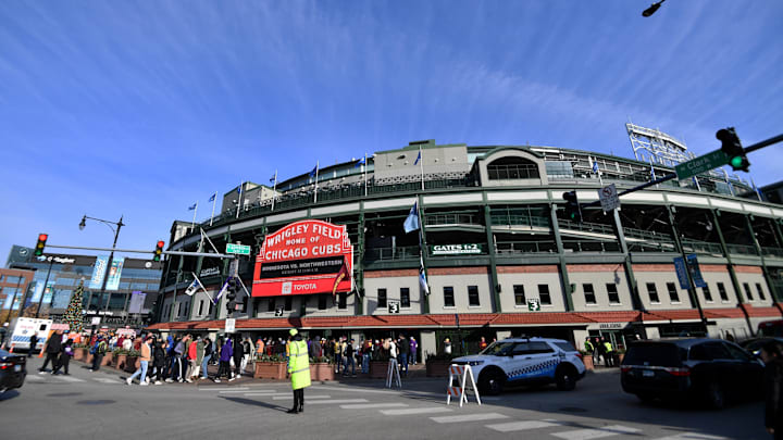 Nov 22, 2025; Chicago, Illinois, USA; The marquee at Addison Street and Clark Street is seen with fans outside prior to a game between the Northwestern Wildcats and the Minnesota Golden Gophers at Wrigley Field. Mandatory Credit: Patrick Gorski-Imagn Images