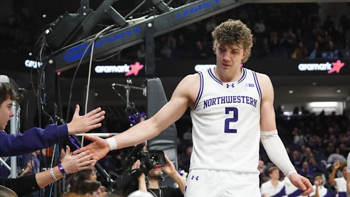 Jan 29, 2026; Evanston, Illinois, USA; Northwestern Wildcats forward Nick Martinelli (2) high fives fans after scoring against the Penn State Nittany Lions during the second half at Welsh-Ryan Arena. Mandatory Credit: David Banks-Imagn Images