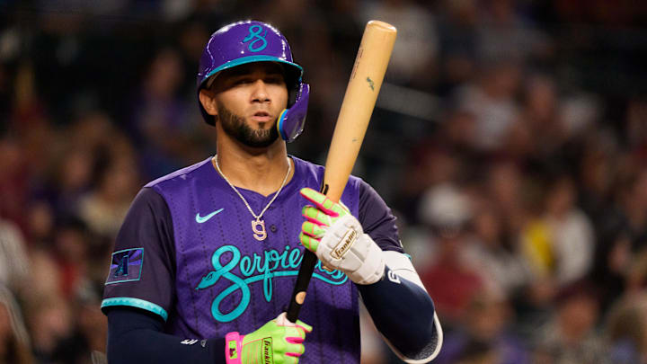 Aug 8, 2025; Phoenix, Arizona, USA; Arizona Diamondbacks outfielder Lourdes Gurriel Jr. (12) reacts as he steps up to the batters box in the eighth inning against the Colorado Rockies at Chase Field. Mandatory Credit: Allan Henry-Imagn Images
