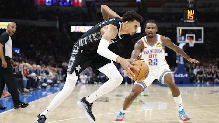 Oct 30, 2024; Oklahoma City, Oklahoma, USA; San Antonio Spurs center Victor Wembanyama (1) drives to the basket beside Oklahoma City Thunder guard Cason Wallace (22) during the second quarter at Paycom Center.