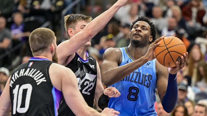 Dec 23, 2025; Salt Lake City, Utah, USA; Memphis Grizzlies forward/center Jaren Jackson Jr. (8) drives to the basket against Utah Jazz center Kyle Filipowski (22) during the first half at Delta Center. Mandatory Credit: Peter Creveling-Imagn Images