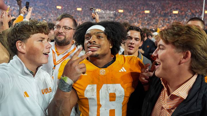 Tennessee running back DeSean Bishop (18) takes a photo with fans after a football game between Tennessee and Alabama at Neyland Stadium in Knoxville, Tenn., on Oct. 17, 2026.