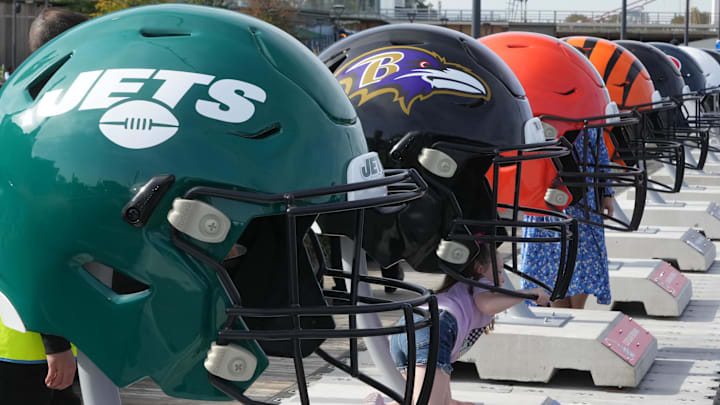 Oct 7, 2023; London, United Kingdom; Large oversized helmets of the New York Jets Baltimore Ravens, Cleveland Browns and Cincinnati Bengals at the NFL Experience London at the Battersea Power Station. Mandatory Credit: Kirby Lee-Imagn Images
