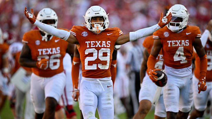 Oct 11, 2025; Dallas, Texas, USA; Texas Longhorns defensive back Graceson Littleton (29) celebrates after he intercepts a pass from Oklahoma Sooners quarterback John Mateer (not pictured) during the second half at the Cotton Bowl. Mandatory Credit: Jerome Miron-Imagn Images