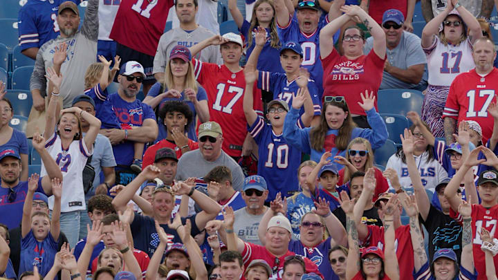 Fans wave their arms hoping that a Bills giveaway item gets thrown their way. Players signed autographs for fans and hung out with their family after the Return of the Blue Red practice at Highmark Stadium in Orchard Park on Aug.1, 2025. Fans wave their arms hoping that a Bills giveaway item gets thrown their way. Players signed autographs for fans and hung out with their family after the Return of the Blue Red practice at Highmark Stadium in Orchard Park on Aug.1, 2025.