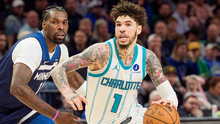 Apr 5, 2026; Minneapolis, Minnesota, USA; Charlotte Hornets guard LaMelo Ball (1) drives by Minnesota Timberwolves center Naz Reid (11) in the fourth quarter at Target Center. 