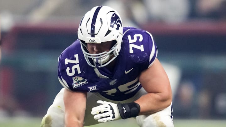 Dec 26, 2024; Phoenix, AZ, USA; Kansas State Wildcats offensive lineman Sam Hecht (75) against the Rutgers Scarlet Knights during the Rate Bowl at Chase Field. Mandatory Credit: Mark J. Rebilas-Imagn Images