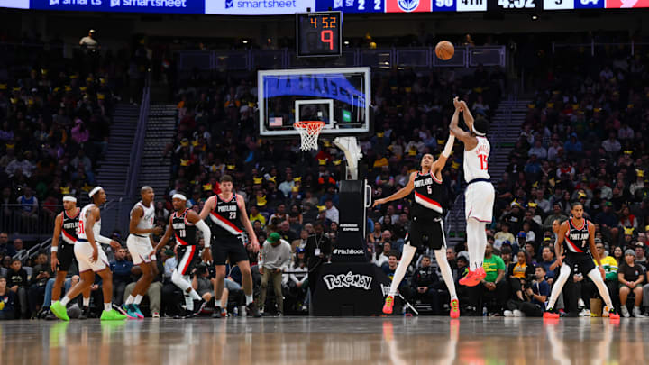 Oct 11, 2024; Seattle, Washington, USA; Los Angeles Clippers guard EJ Harkless (15) shoots the ball over Portland Trail Blazers guard Dalano Banton (5) during the second half at Climate Pledge Arena. Mandatory Credit: Steven Bisig-Imagn Images