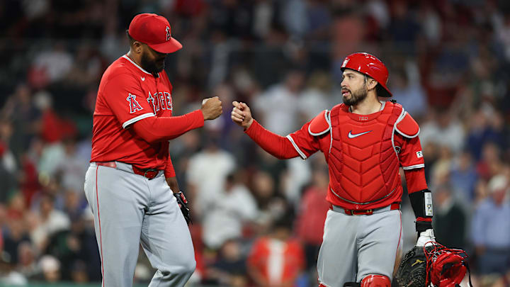 Jun 3, 2025; Boston, Massachusetts, USA; Los Angeles Angels relief pitcher Kenley Jansen (74) and Los Angeles Angels catcher Travis d'Arnaud (25) fist bump during the ninth inning against the Boston Red Sox at Fenway Park. Mandatory Credit: Paul Rutherford-Imagn Images