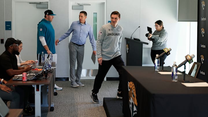 Jacksonville Jaguars general manager James Gladstone, right, enters ahead of head coach Liam Coen during a press conference at Miller Electric Center Tuesday, April 15, 2025 in Jacksonville, Fla. [Corey Perrine/Florida Times-Union]