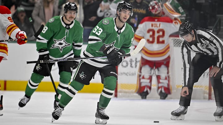 Dec 8, 2024; Dallas, Texas, USA; Dallas Stars center Sam Steel (18) and center Wyatt Johnston (53) skate off the ice after Johnston scores a a short-handed goal against Calgary Flames goaltender Dustin Wolf (32) during the first period at the American Airlines Center. Mandatory Credit: Jerome Miron-Imagn Images