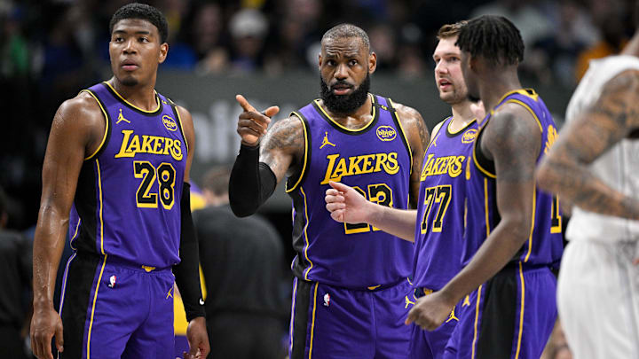 Los Angeles Lakers forward Rui Hachimura (28) and forward LeBron James (23) and guard Luka Doncic (77), and forward Dorian Finney-Smith (17) at American Airlines Center.