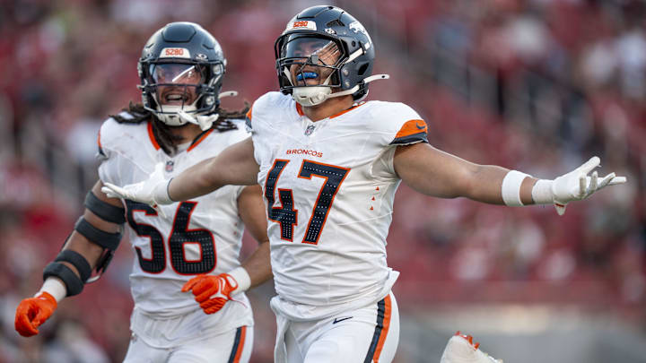 August 9, 2025; Santa Clara, California, USA; Denver Broncos linebacker Karene Reid (47) celebrates intercepting the football with linebacker Levelle Bailey (56) against the San Francisco 49ers during the second quarter at Levi's Stadium. Mandatory Credit: Kyle Terada-Imagn Images