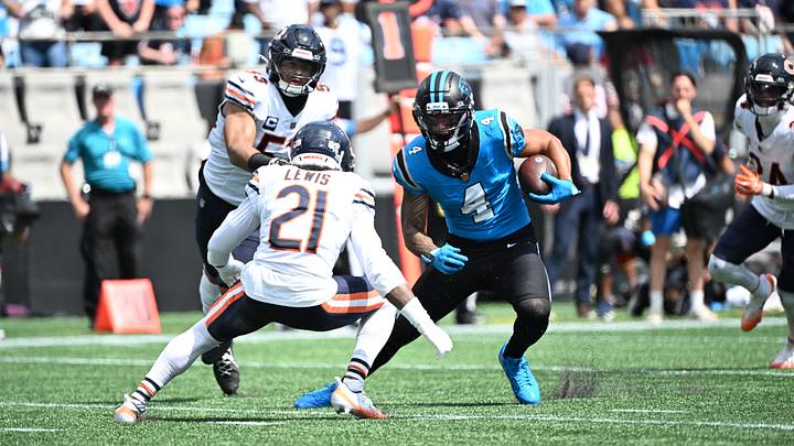 Tetairoa McMillan tries to get around Cam Lewis in Sunday's Bears win. Tetairoa McMillan tries to get around Cam Lewis in Sunday's Bears win.
