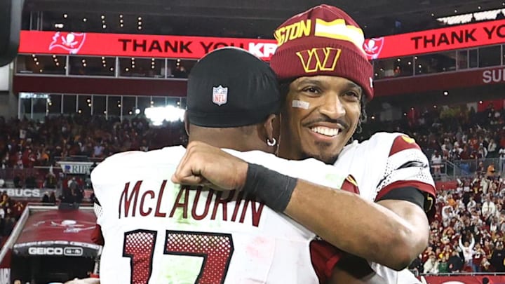 Jan 12, 2025; Tampa, Florida, USA; Washington Commanders quarterback Jayden Daniels (5) celebrates with wide receiver Terry McLaurin (17) after winning a NFC wild card playoff against the Tampa Bay Buccaneers at Raymond James Stadium. Mandatory Credit: Kim Klement Neitzel-Imagn Images